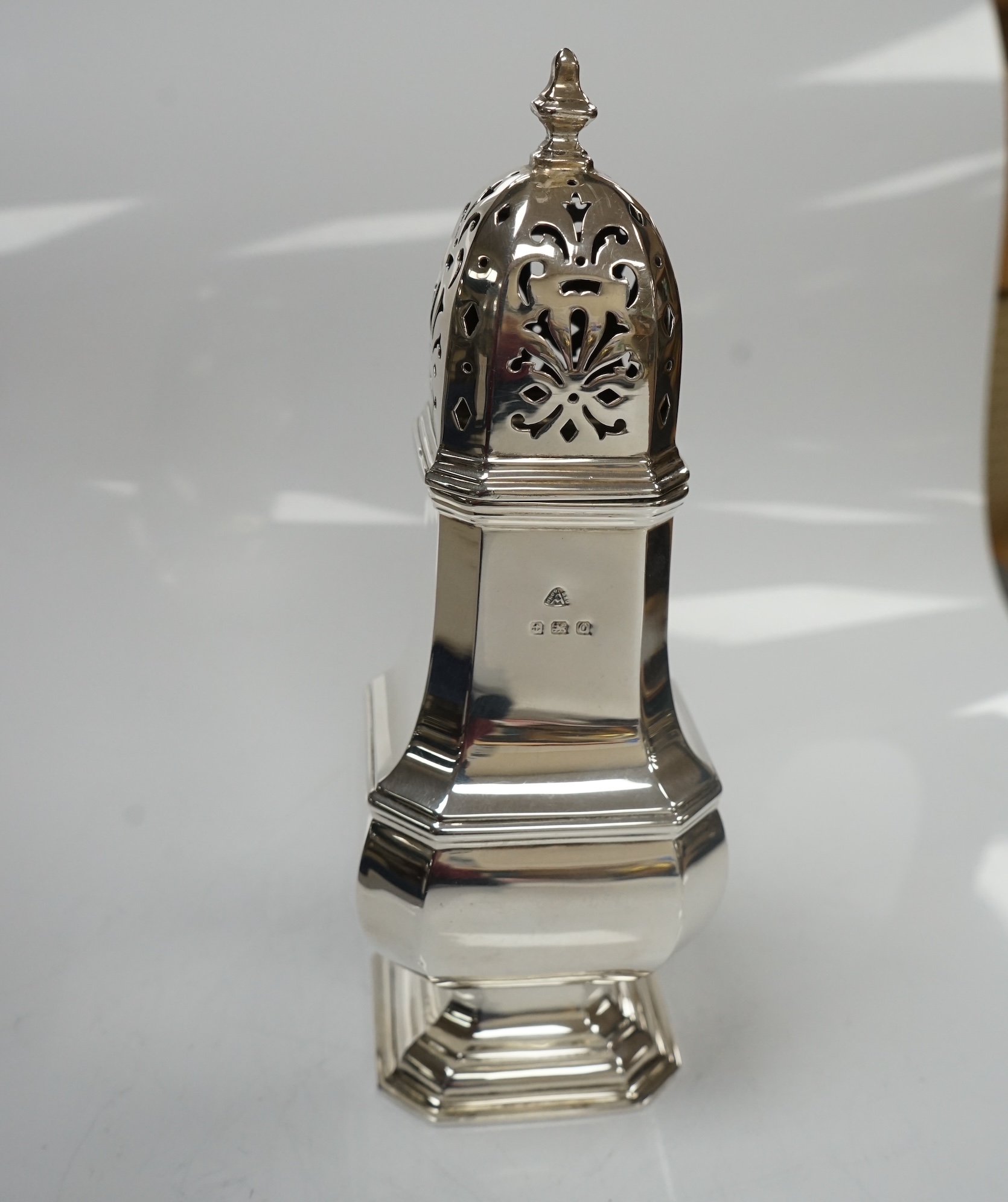 A George V silver octagonal baluster sugar castor, by Adie Bros, height 18.3cm, 5.3oz. Condition - poor